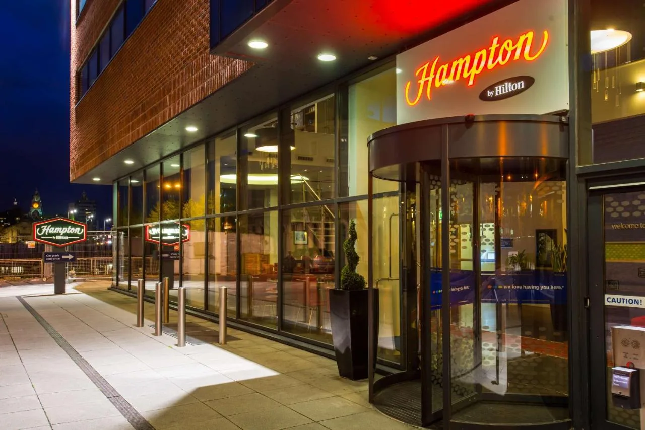 Storefront view at night of the hotel on Hurst Street, Liverpool