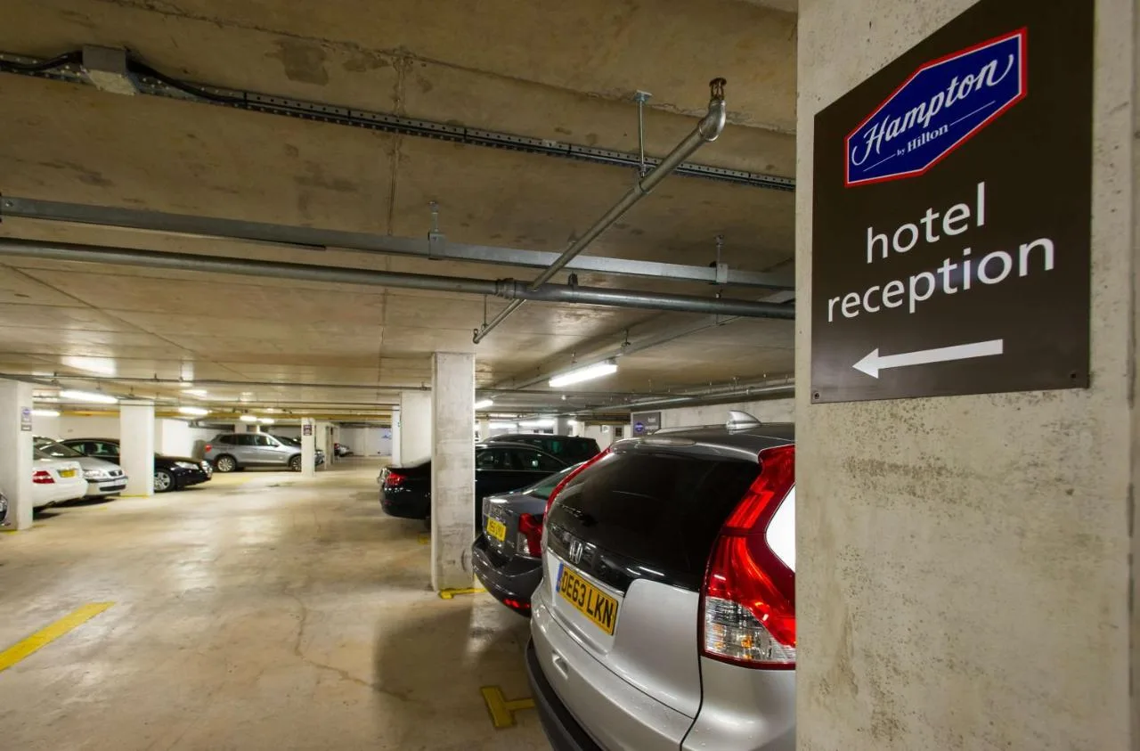 On-site parking garage with cars parked at the hotel