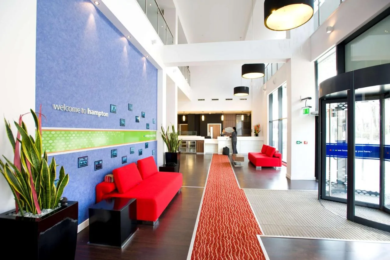 Hotel lobby with red furniture and red carpet